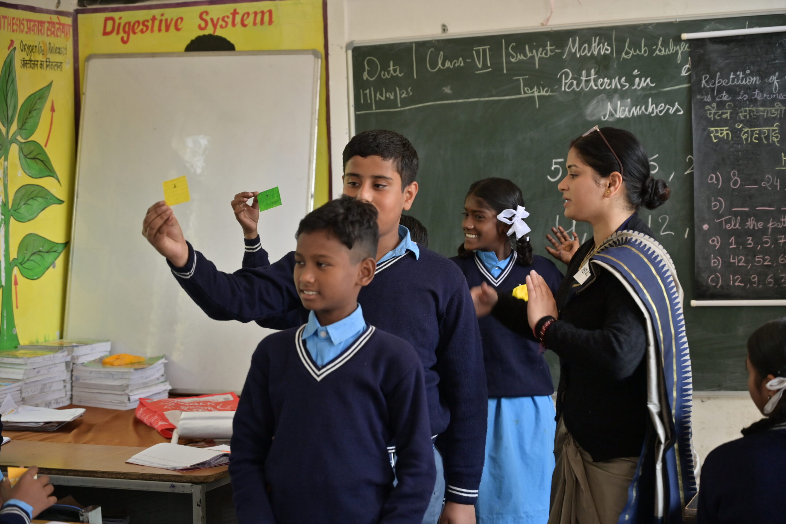 Teacher interacting with students in a classroom